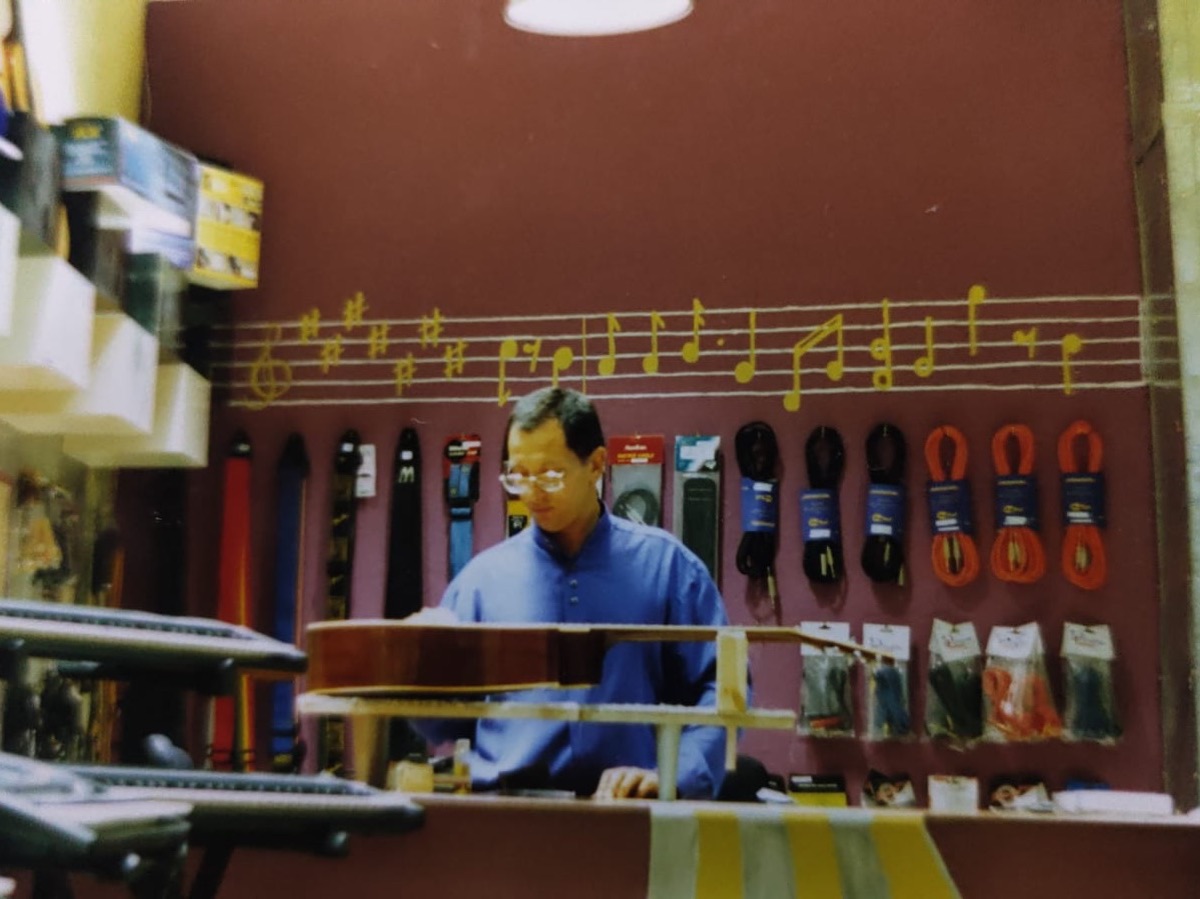 An archive photo from the early days of The Pianoman: behind the shop counter